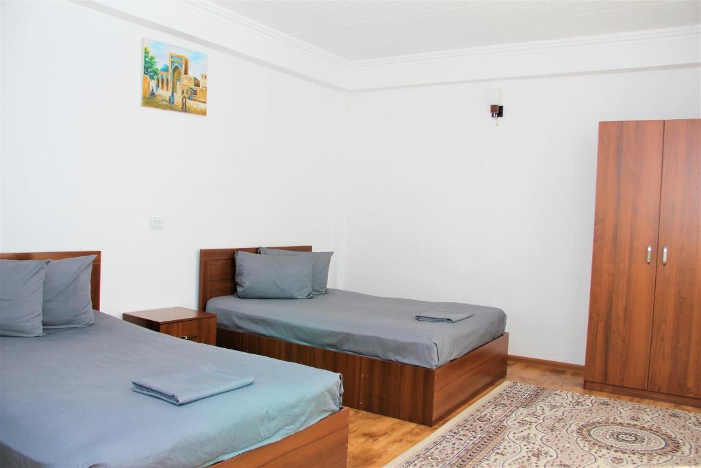 Postel nebo postele na pokoji v ubytování Anvar's Guests