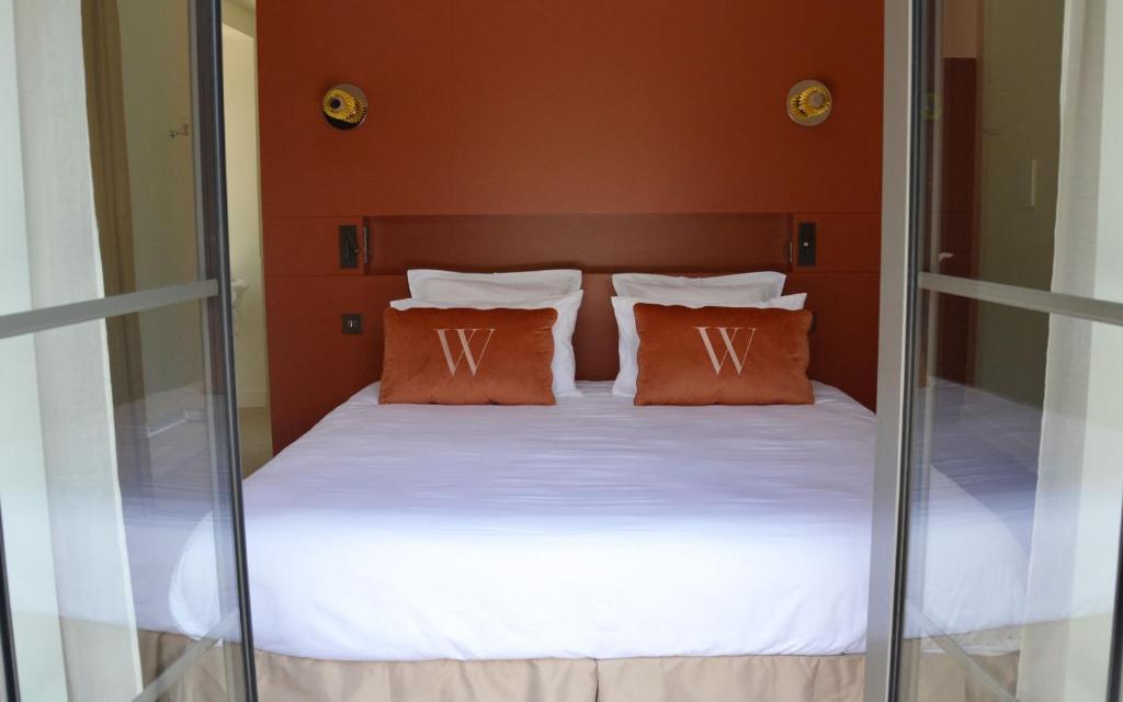 Postel nebo postele na pokoji v ubytování Hôtel Villa Walbaum