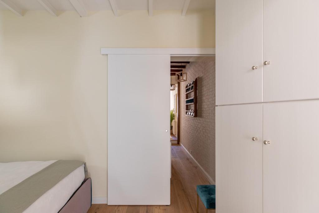 A bed or beds in a room at iFlat The Heart of Monti