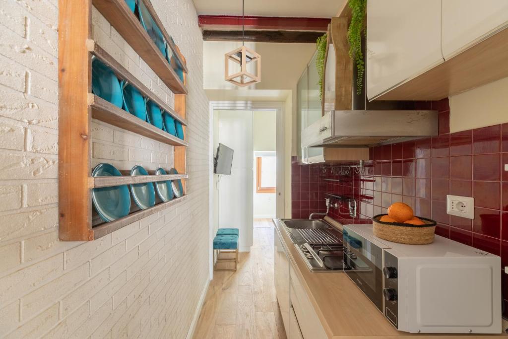 A kitchen or kitchenette at iFlat The Heart of Monti