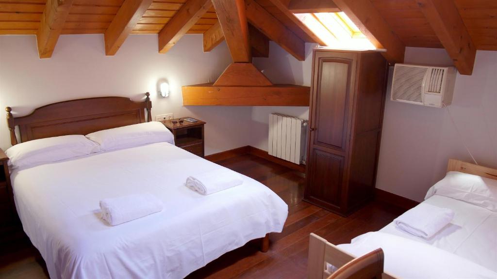 Postel nebo postele na pokoji v ubytování Hotel Branka