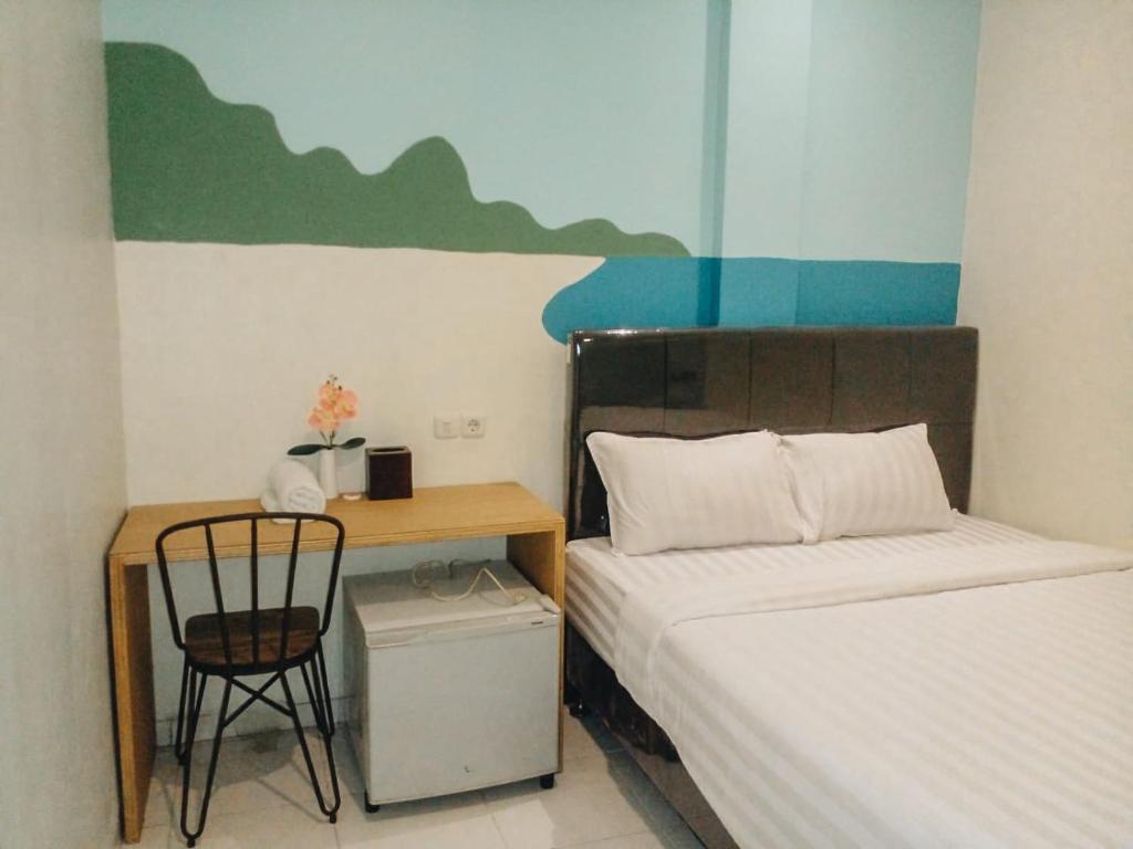 Postel nebo postele na pokoji v ubytování Capital Hotel