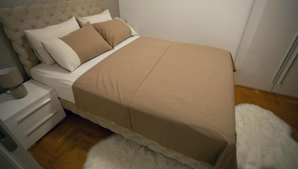 Postel nebo postele na pokoji v ubytování Apartman SUNSET