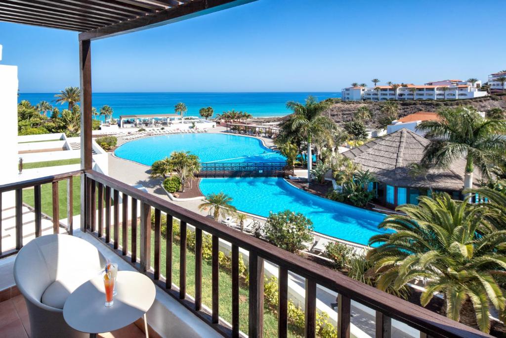 a view of the pool from the balcony of a resort at Fuerteventura Princess in Playa Jandia