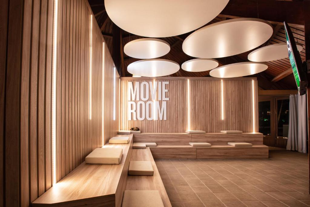 a lobby with a movie room with benches and lights at Fuerteventura Princess in Playa Jandia