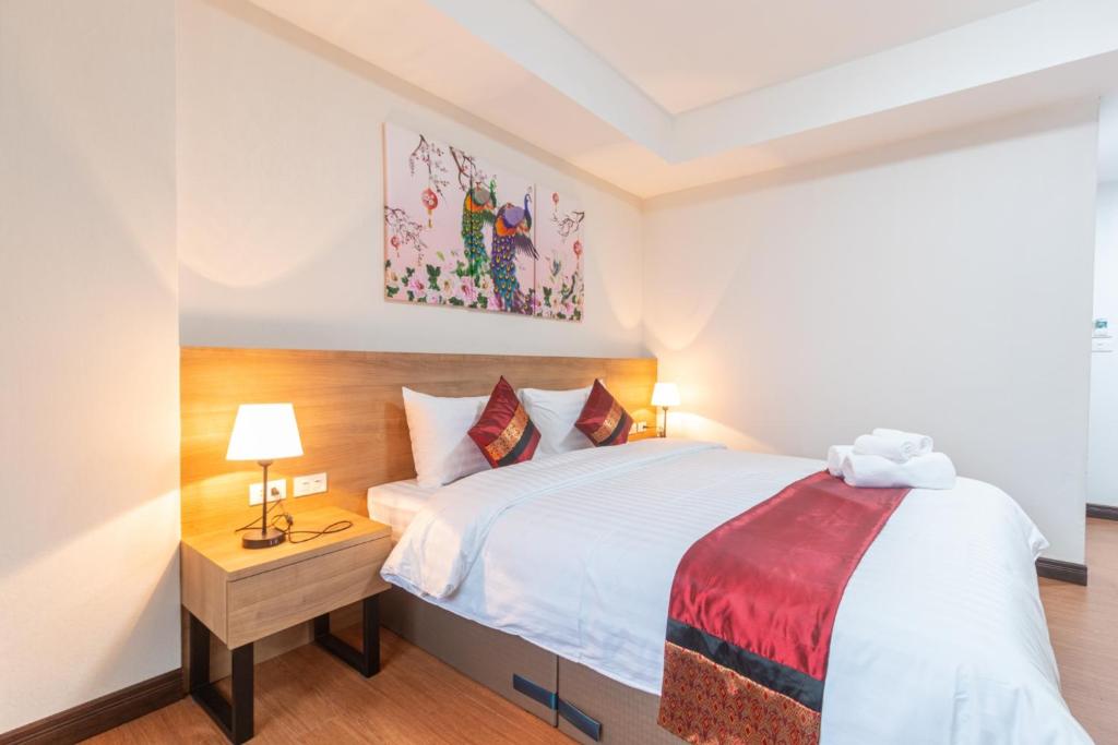 Postel nebo postele na pokoji v ubytování Peacock De Pai Hotel