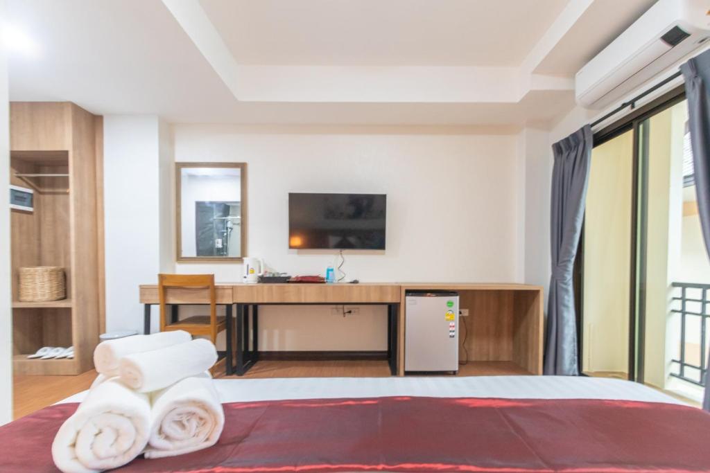 Postel nebo postele na pokoji v ubytování Peacock De Pai Hotel