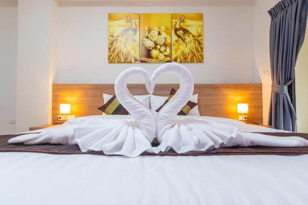 Postel nebo postele na pokoji v ubytování Peacock De Pai Hotel