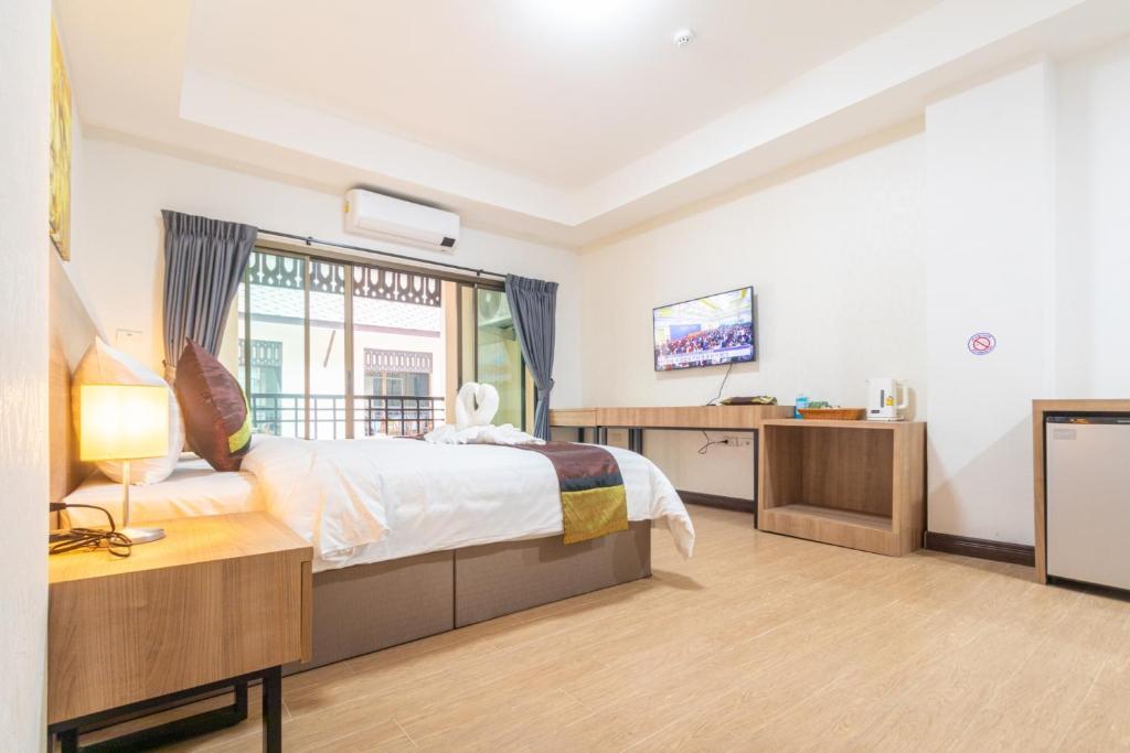 Postel nebo postele na pokoji v ubytování Peacock De Pai Hotel