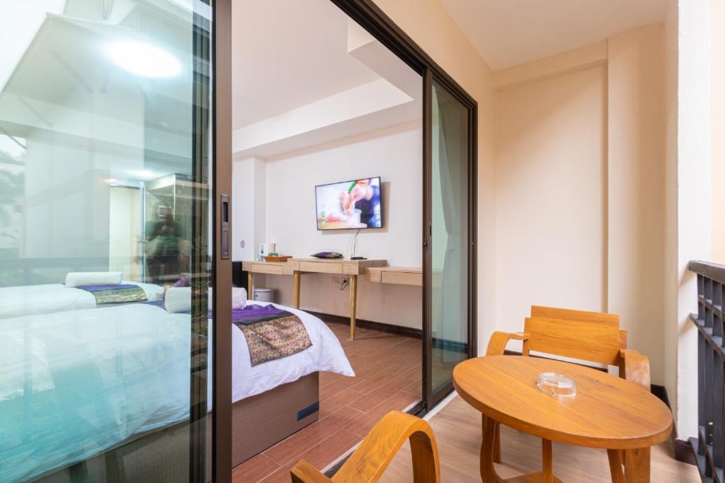 TV a/nebo společenská místnost v ubytování Peacock De Pai Hotel