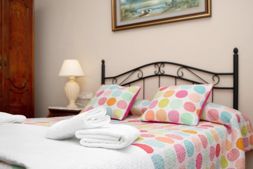 A bed or beds in a room at Casa Macarena