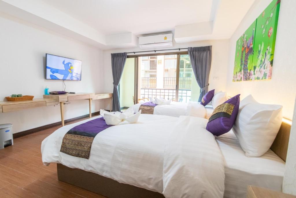 Postel nebo postele na pokoji v ubytování Peacock De Pai Hotel