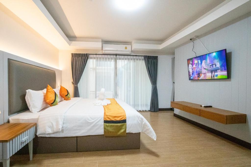 Postel nebo postele na pokoji v ubytování Peacock De Pai Hotel
