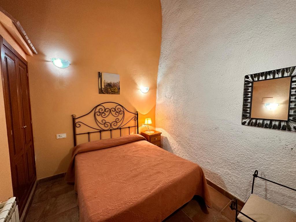 Cama o camas de una habitación en Cuevas La Granja