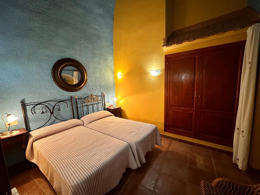 Cama o camas de una habitación en Cuevas La Granja