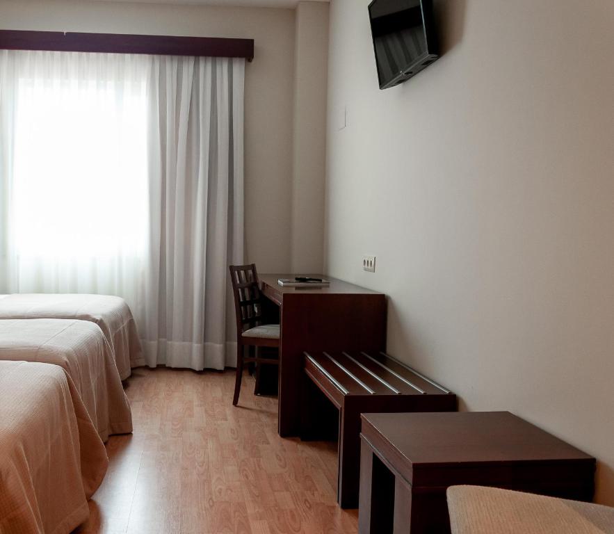 Postel nebo postele na pokoji v ubytování ARVA Santiago León