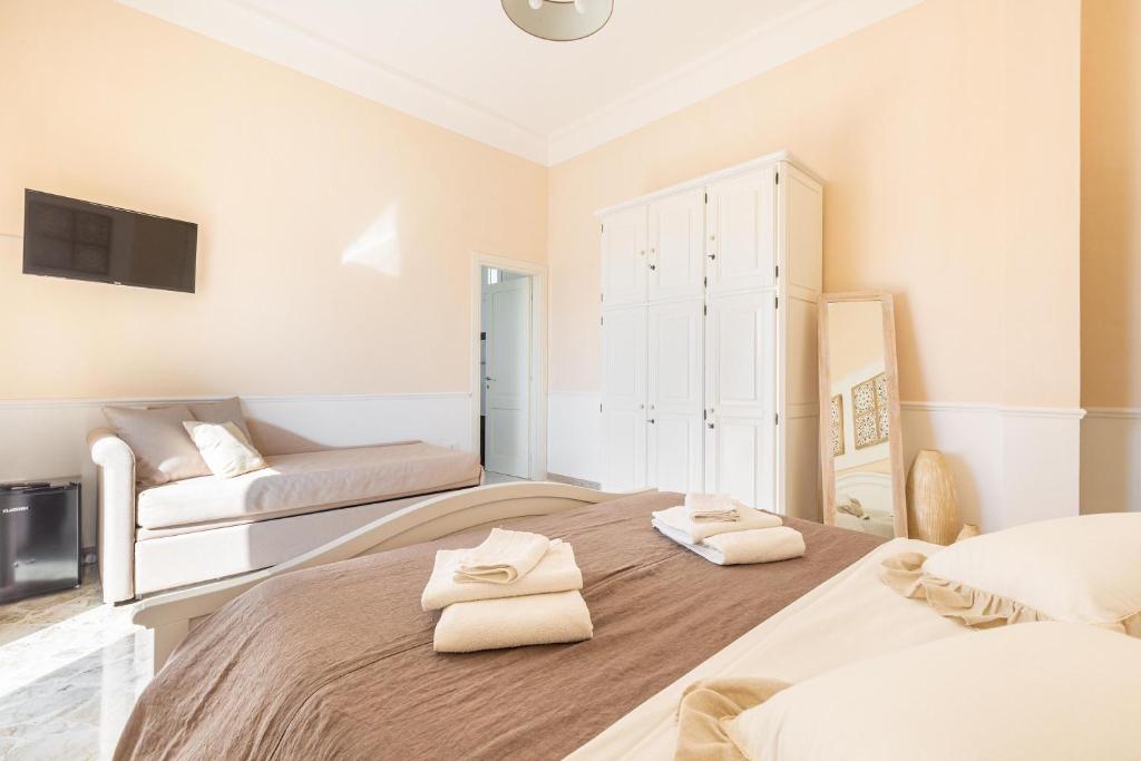 Postel nebo postele na pokoji v ubytování Dimora Le Tre Muse Guesthouse