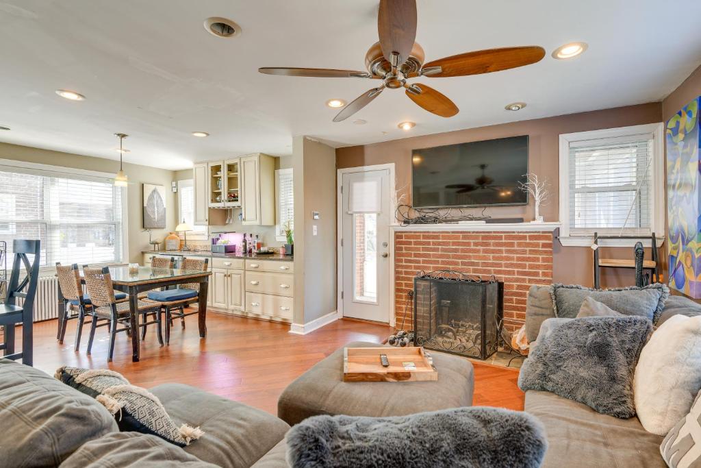 a living room with a couch and a fireplace at WFH-Friendly Vacation Rental in DC! in Washington