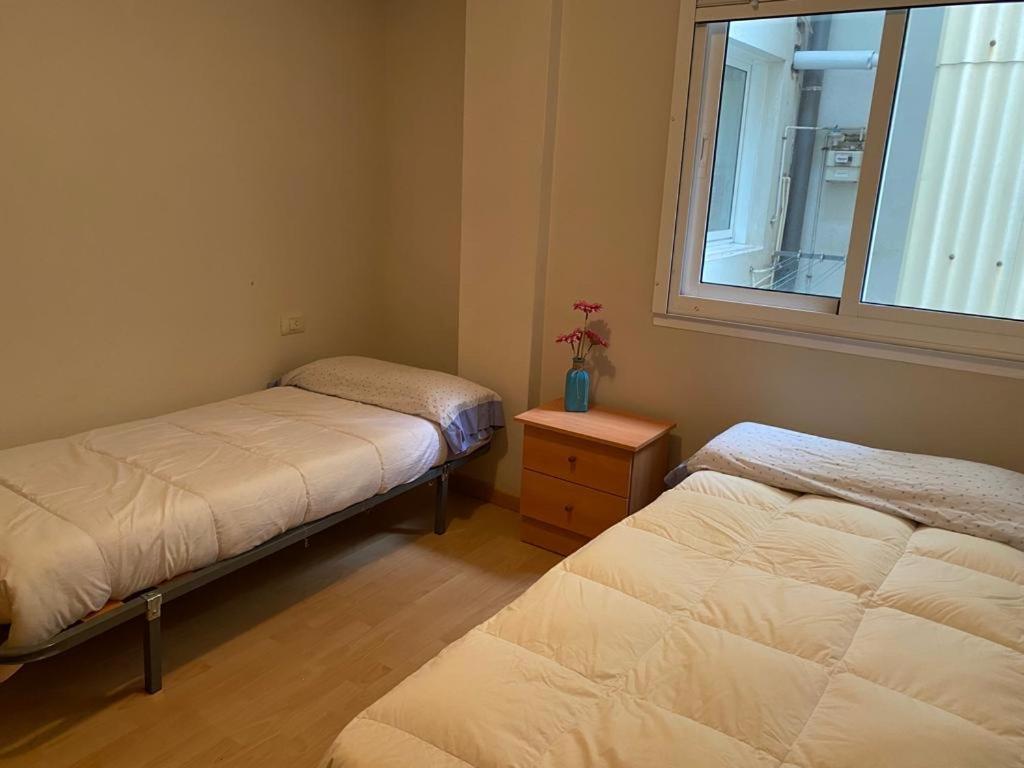 Cama o camas de una habitación en Apartamento turístico al lado de la ria de vigo