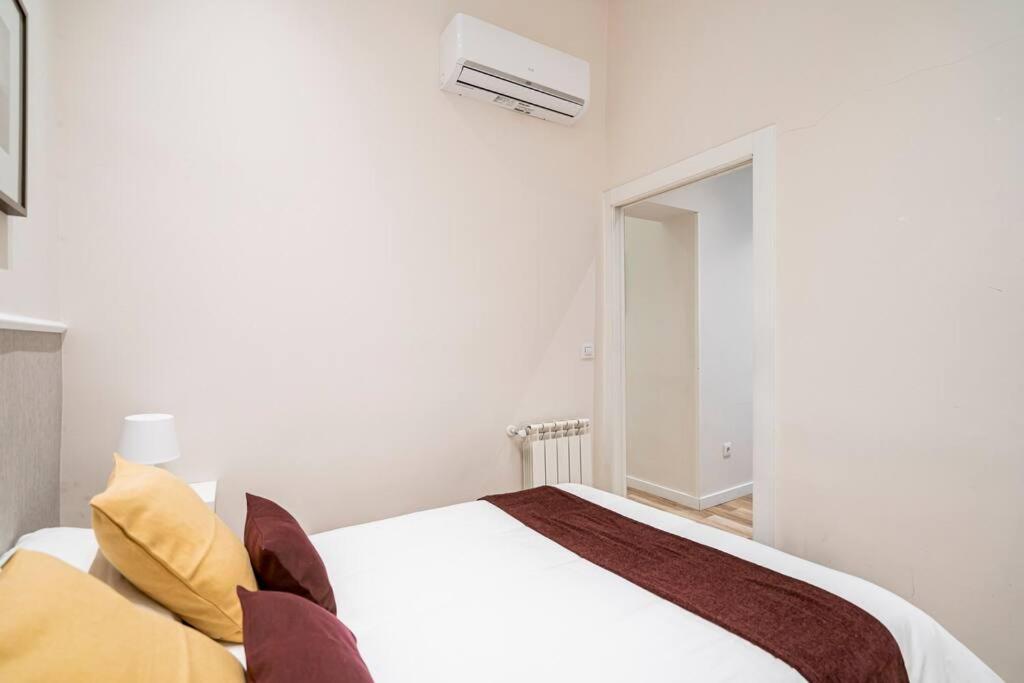 Postel nebo postele na pokoji v ubytování Victor Apartments Prado