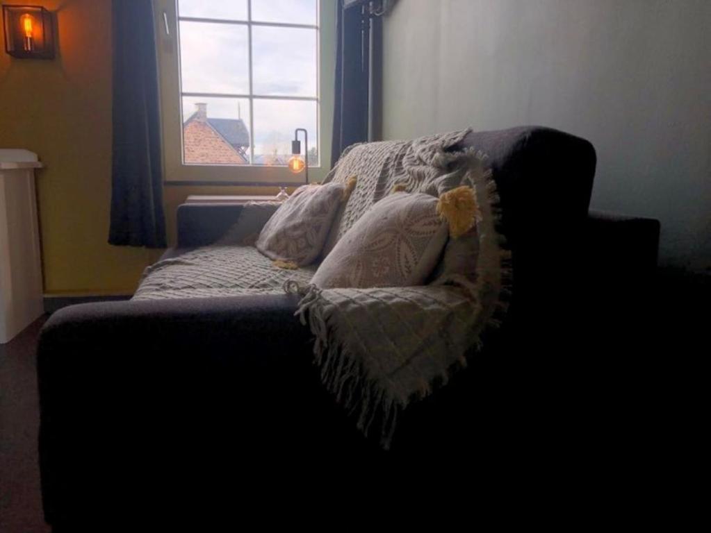 Postel nebo postele na pokoji v ubytování Hotel Le Limbourg