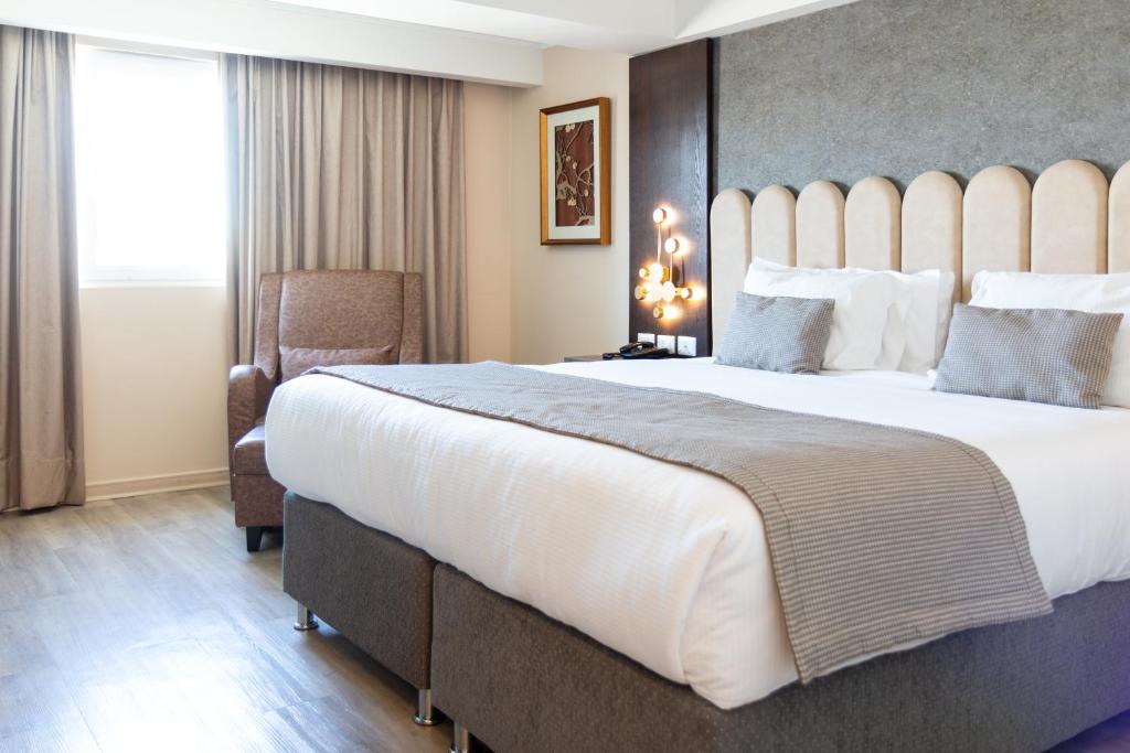 Postel nebo postele na pokoji v ubytování Hotel HW High Wellness