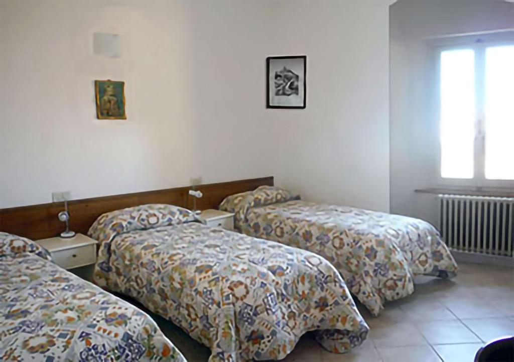 Posteľ alebo postele v izbe v ubytovaní Camere Gambacorta Assisi