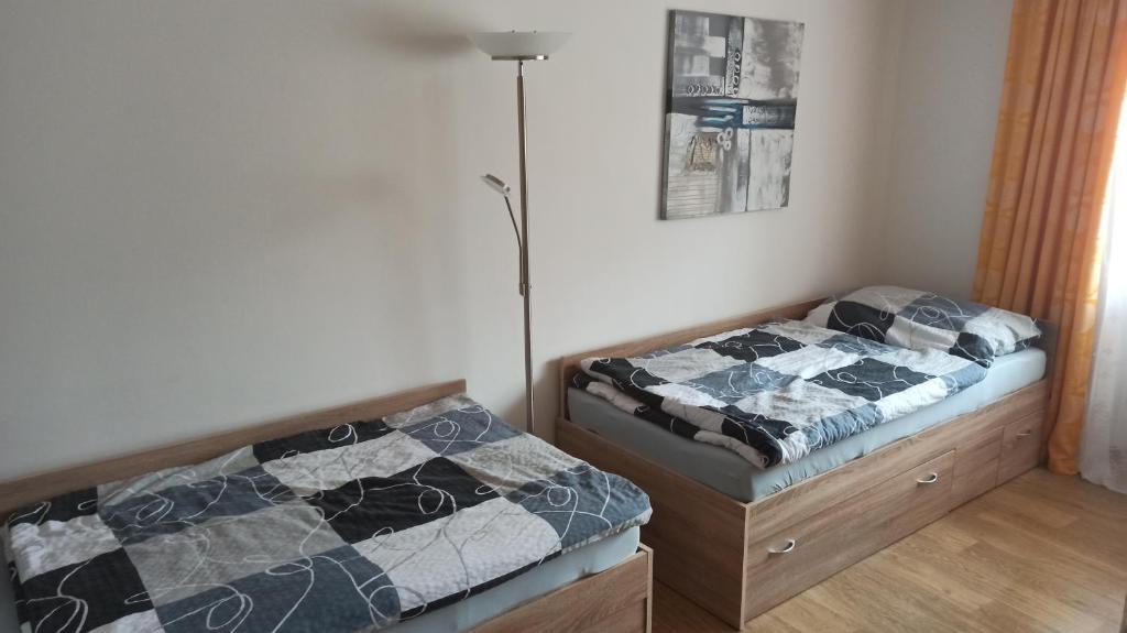 Postel nebo postele na pokoji v ubytování Chaloupka u Vejvodů