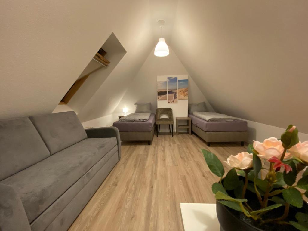 a living room with a couch and a table at Waren Appartements in Waren