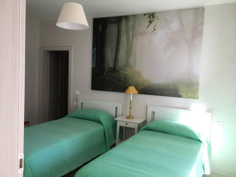 A bed or beds in a room at APPARTAMENTO FONTANE DUE Bagni
