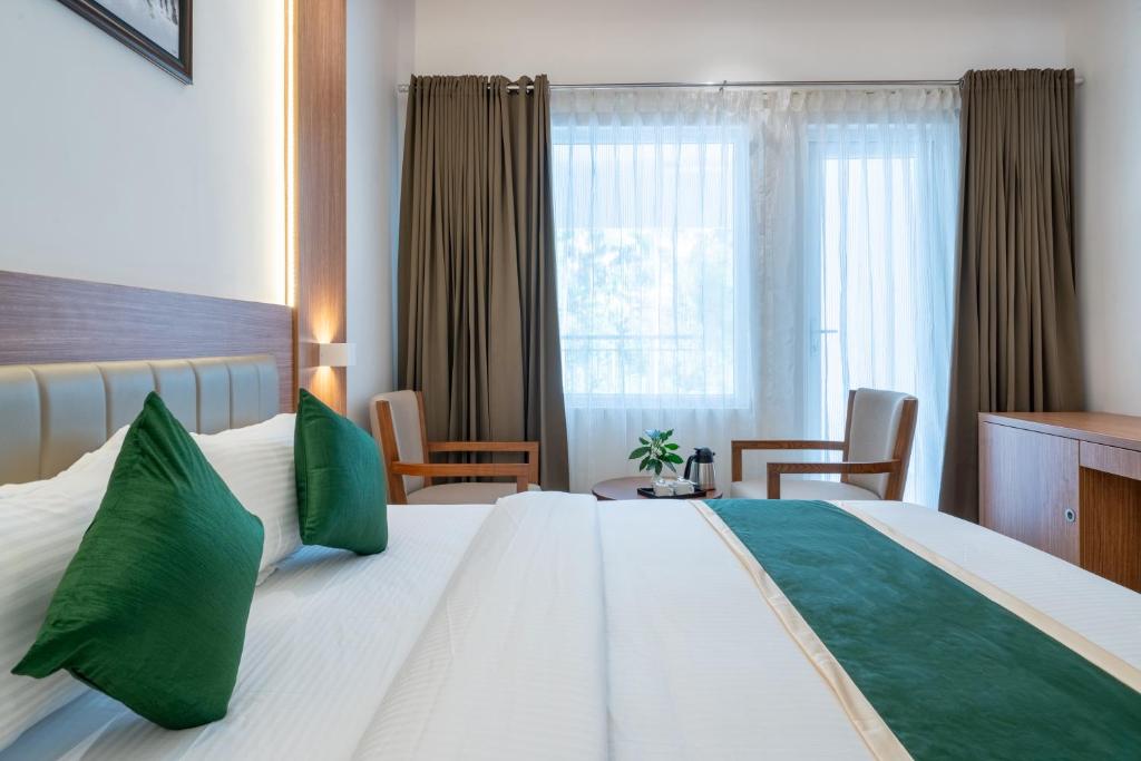 Postel nebo postele na pokoji v ubytování Hotel Panoramic