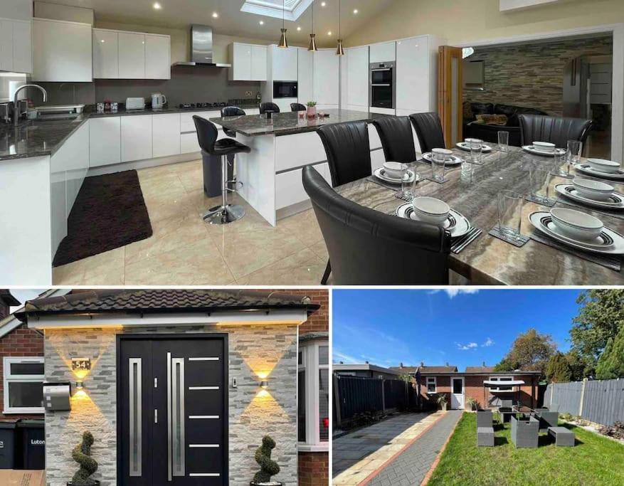 a kitchen and dining room with a table in a house at Luxurious Kitchen, 4BR Home with Free Parking near Airport for Contractor Holiday for 8 People in Luton