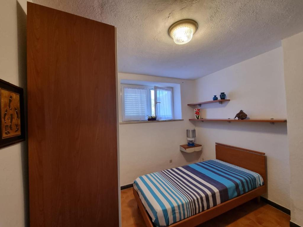 Łóżko lub łóżka w pokoju w obiekcie CASA GAIA - Limoncello - parcheggio privato incluso