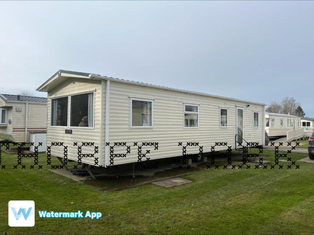 a flock of birds standing around a mobile home at Caravan Holiday on Haven site in Cleethorpes