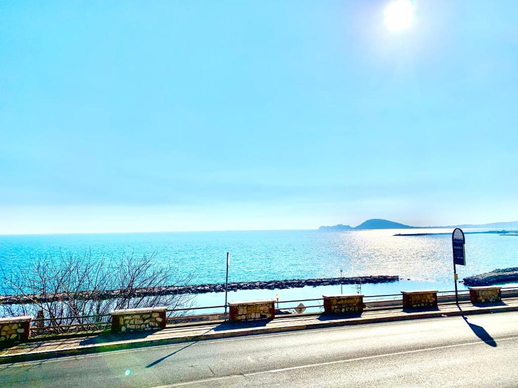 a road next to a body of water at Casa Vacanze Formia in Formia