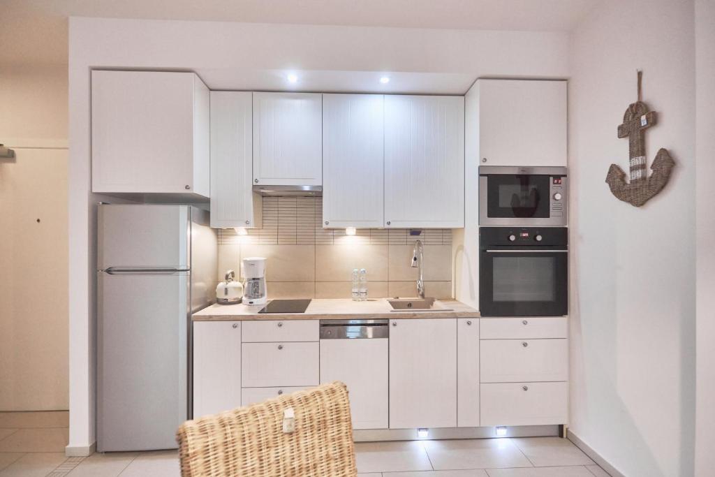 Kuchyňa alebo kuchynka v ubytovaní Apartament Riviera z tarasem - Playa Baltis