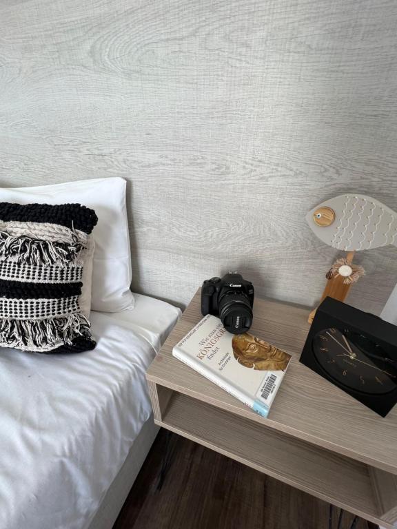 a camera on a table next to a bed at Fatolitis Studios in Masouri