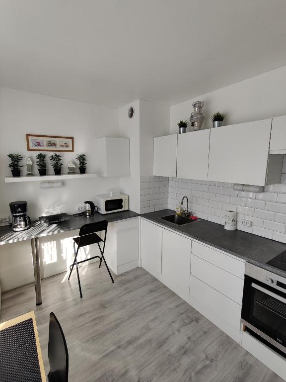 Kuchyň nebo kuchyňský kout v ubytování Sweet family apartments Hamina