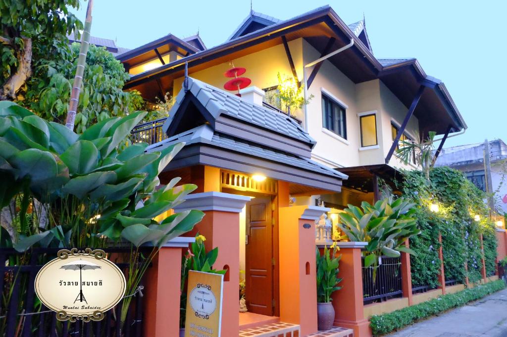 a house with a sign in front of it at Wualai Sabaidee in Chiang Mai