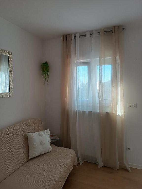 Postel nebo postele na pokoji v ubytování Apartman ANAMARIA