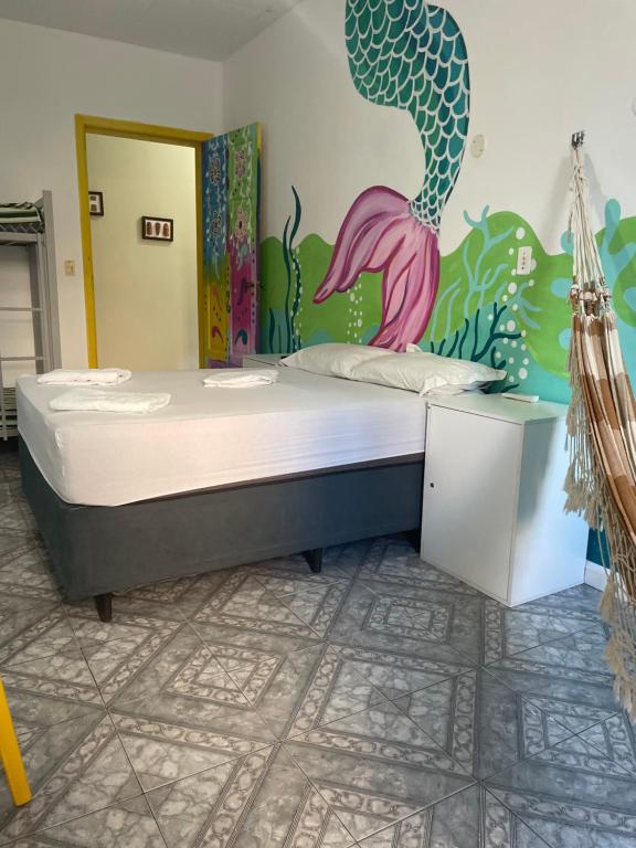 Postel nebo postele na pokoji v ubytování Porto das Palmeiras Hostel