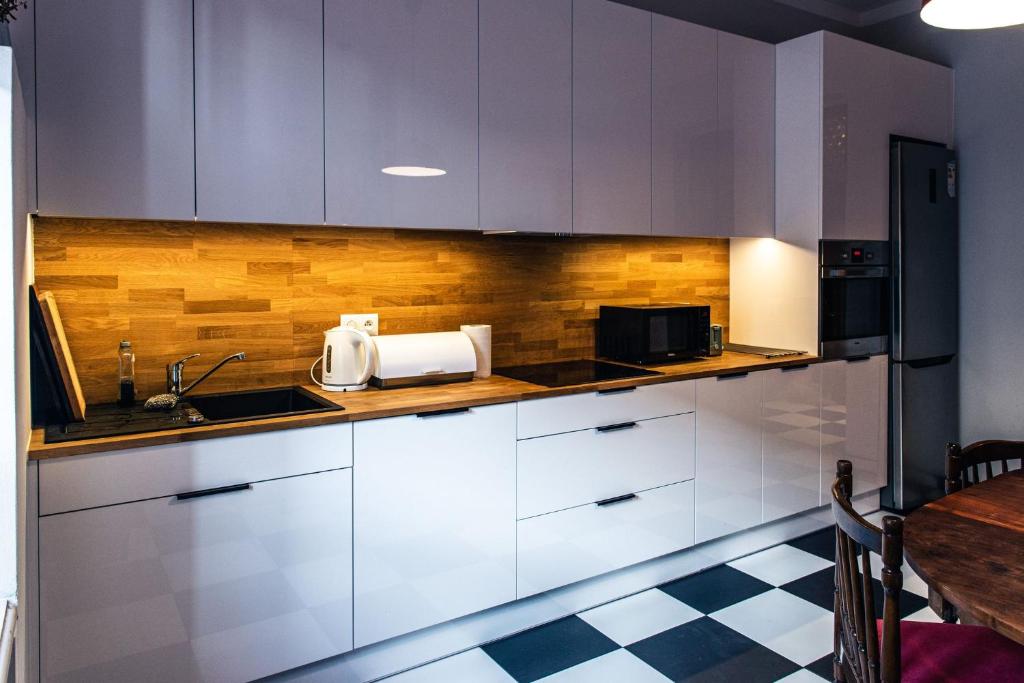 Kuchyň nebo kuchyňský kout v ubytování Apartament Cafe Belg