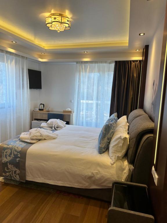 Postel nebo postele na pokoji v ubytování hotel whiteswan