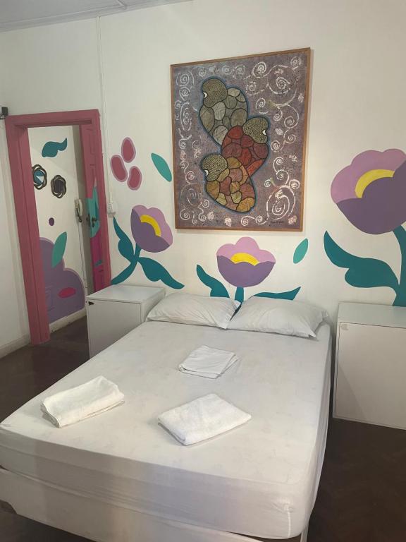 Postel nebo postele na pokoji v ubytování Porto das Palmeiras Hostel