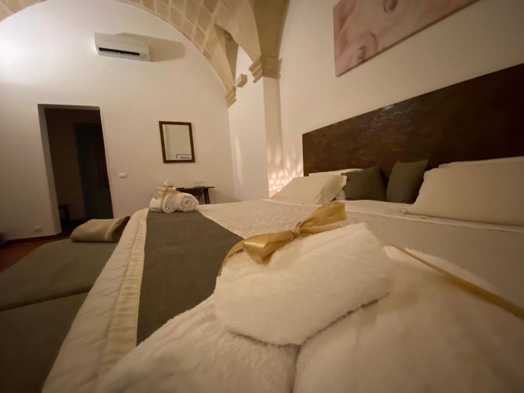 Un ou plusieurs lits dans un hébergement de l'établissement Miro B&B