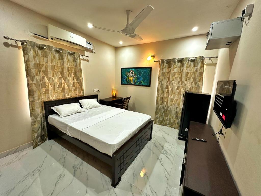 Postel nebo postele na pokoji v ubytování Sri Apartment Deluxe Room A3