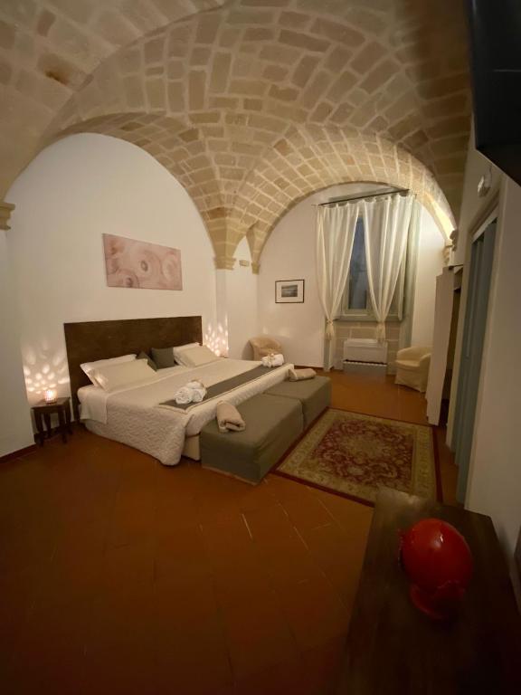 Un ou plusieurs lits dans un hébergement de l'établissement Miro B&B