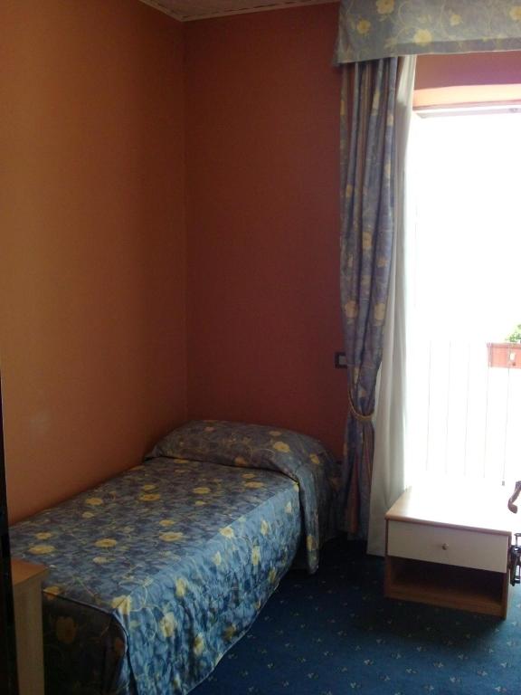 Postel nebo postele na pokoji v ubytování Hotel Beata Giovannina