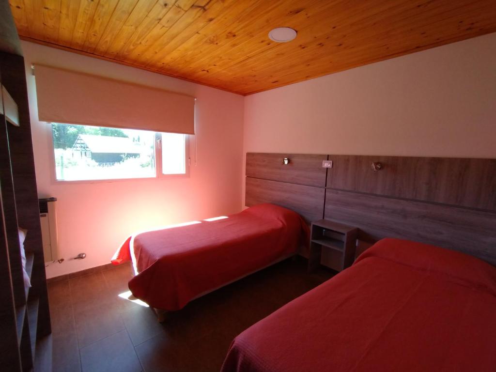 Postel nebo postele na pokoji v ubytování Aluminé Cabañas