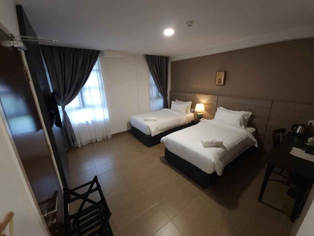 Postel nebo postele na pokoji v ubytování Yu Hotel Chinatown